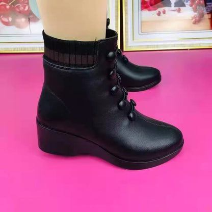 Botas de tacón oblicuo de piel suave para mujer